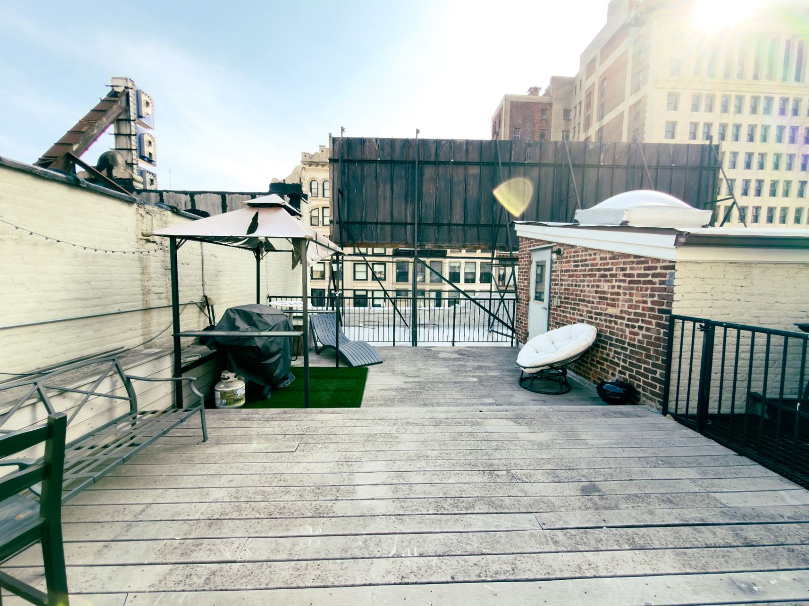 Private rooftop deck with grill and skyline views